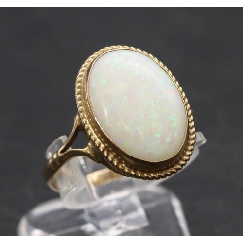 459 - A 9ct gold ladies' oval opal ring, Size L, 1.9 grams gross