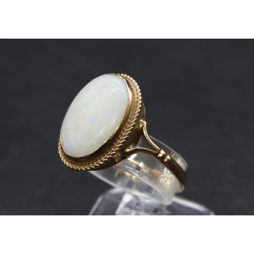 459 - A 9ct gold ladies' oval opal ring, Size L, 1.9 grams gross