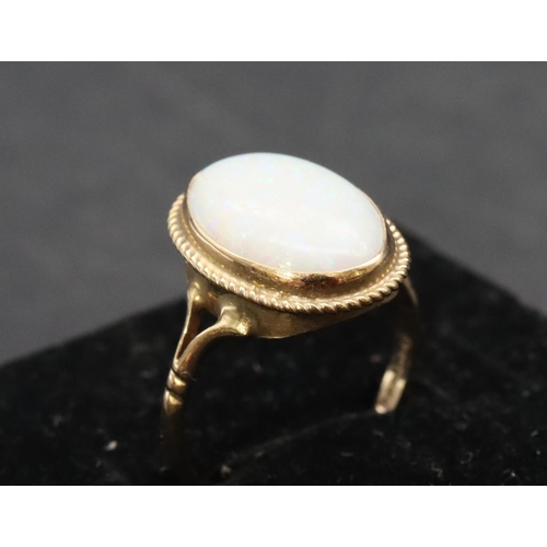 459 - A 9ct gold ladies' oval opal ring, Size L, 1.9 grams gross