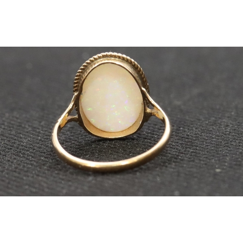 459 - A 9ct gold ladies' oval opal ring, Size L, 1.9 grams gross