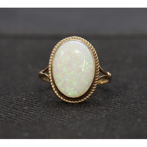 459 - A 9ct gold ladies' oval opal ring, Size L, 1.9 grams gross