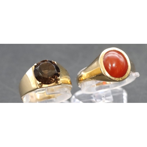 460 - A 9ct gold smoky quartz ring, Size J/K and a 9ct gold ring set with red stone, Size P/Q, overall wei... 