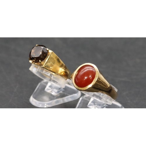 460 - A 9ct gold smoky quartz ring, Size J/K and a 9ct gold ring set with red stone, Size P/Q, overall wei... 