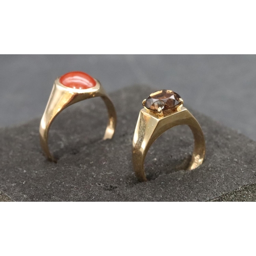 460 - A 9ct gold smoky quartz ring, Size J/K and a 9ct gold ring set with red stone, Size P/Q, overall wei... 