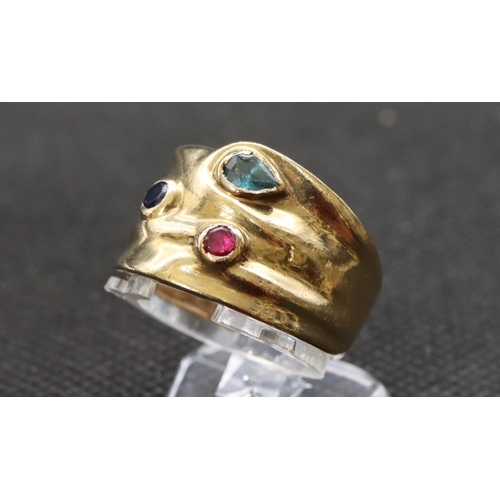 463 - A 9ct gold wide band ladies' ring set with red, blue and turquoise stones, 5.7 grams gross size O/P