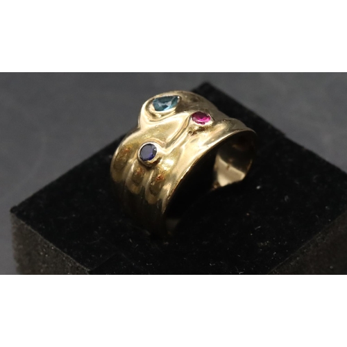 463 - A 9ct gold wide band ladies' ring set with red, blue and turquoise stones, 5.7 grams gross size O/P