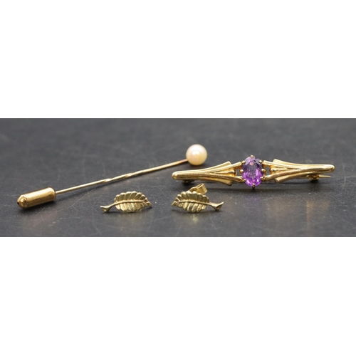 465 - A 9ct  gold bar brooch set with amethyst, a small gold tie pin set with a single pearl and a pair of... 