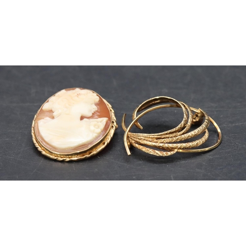 466 - A 9ct gold brooch with scroll decoration and a 9ct gold cameo brooch/pendant, overall weight 7.6 gra... 