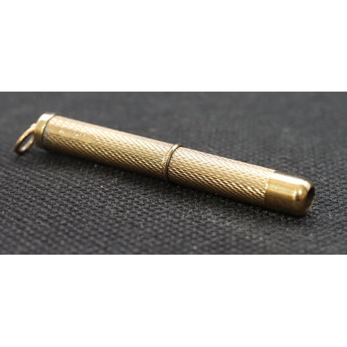 470 - A 9ct gold propelling toothpick with engine turned decoration, 6.3 grams gross