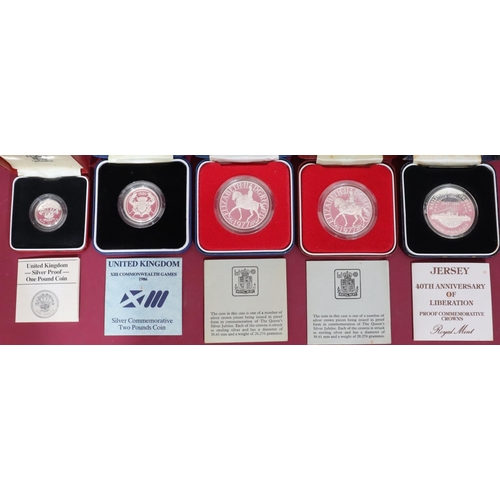 473 - 5 proof coins: One Pound, 1986 Commonwealth Games, Silver Jubilee and Jersey 40th Anniversary (all b... 