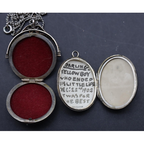 481 - A circular swivel locket pendant with chain and a silver oval locket (2)