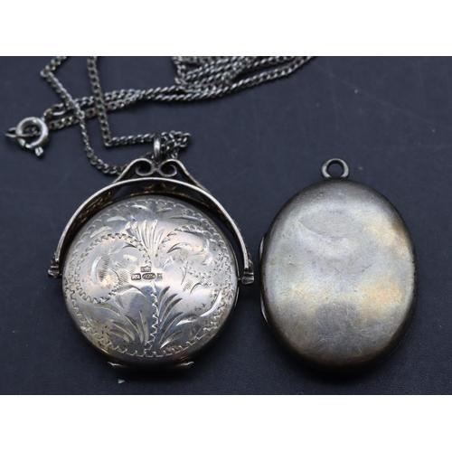 481 - A circular swivel locket pendant with chain and a silver oval locket (2)