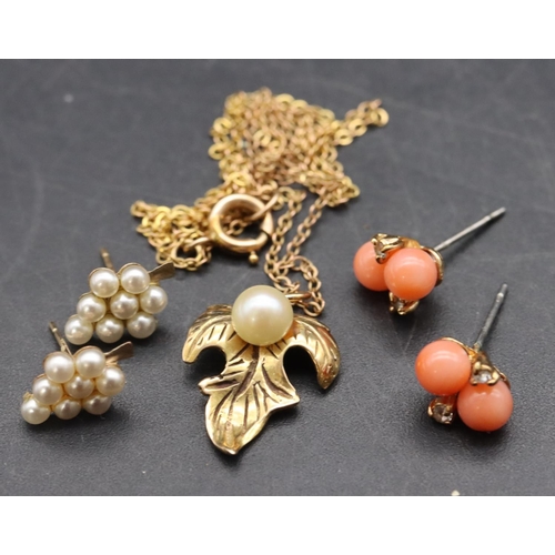 484 - A 9ct gold pendant in the form of a leaf with pearl motif and chain, a pair of coral earrings and an... 