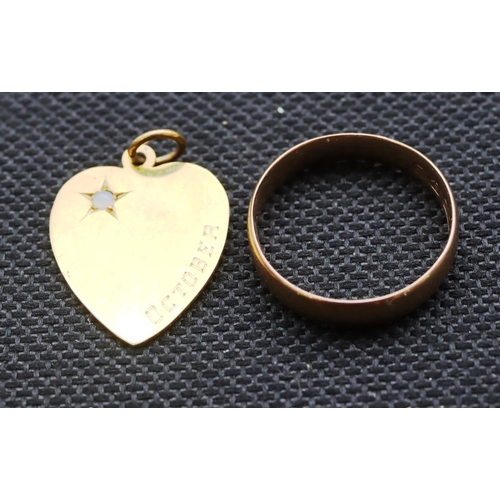 485 - A 9ct gold heart shaped pendant set with a small opal and a 9ct gold wedding ring, Size N, 3.7 grams... 