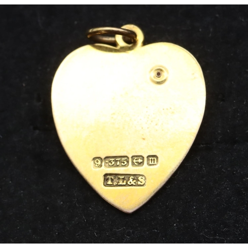 485 - A 9ct gold heart shaped pendant set with a small opal and a 9ct gold wedding ring, Size N, 3.7 grams... 