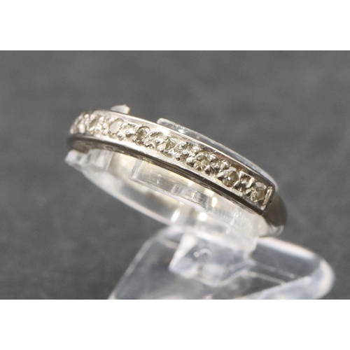 505 - An 18ct white gold ladies' half eternity ring set with small diamond chips, Size P, 3.7 grams gross