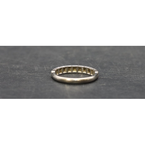 505 - An 18ct white gold ladies' half eternity ring set with small diamond chips, Size P, 3.7 grams gross