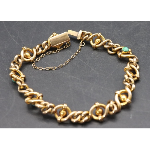 508 - A gold bracelet mounted with turquoise, 13.3 grams gross