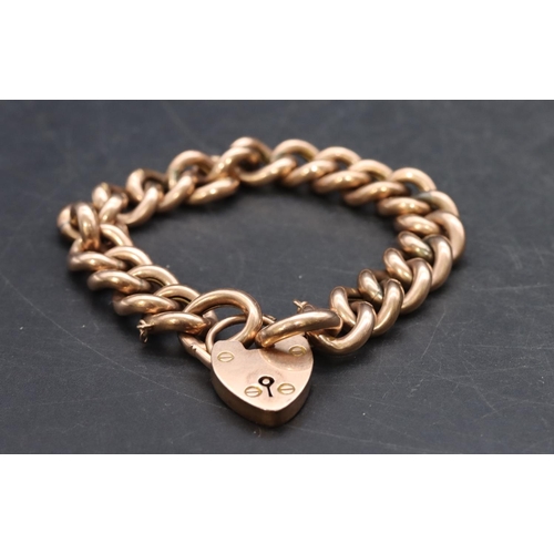 509 - A 9ct curve linked bracelet with padlock clasp, 25.6 grams, chain 20cm long.