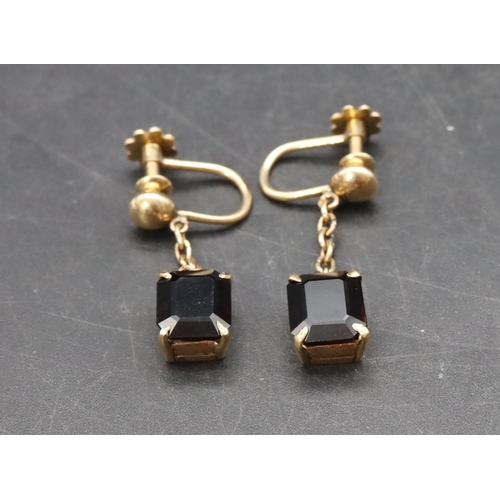 513 - A pair of 18ct gold garnet drop earrings, 5.6 grams gross