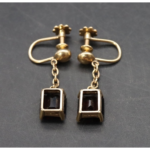 513 - A pair of 18ct gold garnet drop earrings, 5.6 grams gross