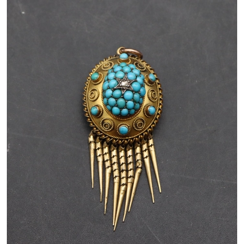 514 - A 15ct gold oval pendant with drop tassels and centre small diamond surrounded turquoise, 5cm high o... 