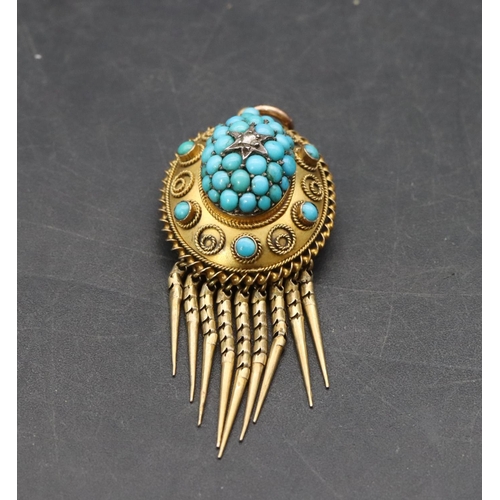 514 - A 15ct gold oval pendant with drop tassels and centre small diamond surrounded turquoise, 5cm high o... 