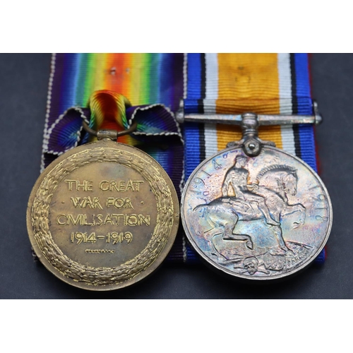 518 - A pair of WWI military medals, 1914/18 medal and Defence medal 