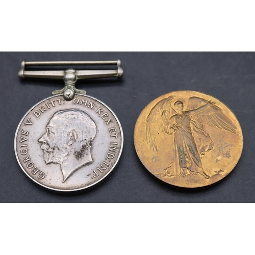 521 - A pair of WWI military medals: 1914/18 medal and war medal 