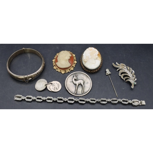 527 - An oval cameo figurehead of a lady, a Chester silver hinged bangle with engraved decoration and a sm... 