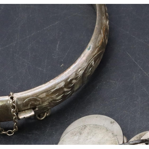 527 - An oval cameo figurehead of a lady, a Chester silver hinged bangle with engraved decoration and a sm... 