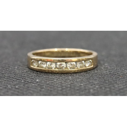 530 - A 9ct gold ladies' half eternity ring set with clear stones, Size J, 1.7 grams