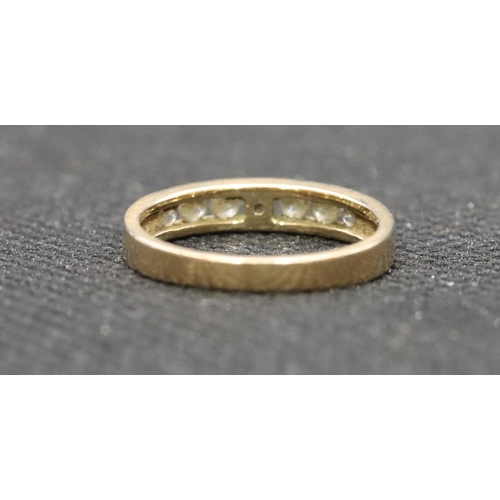 530 - A 9ct gold ladies' half eternity ring set with clear stones, Size J, 1.7 grams