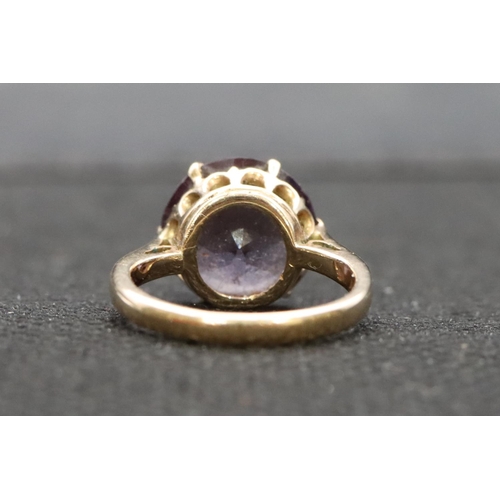 531 - A ladies' gold ring set with amethyst, Size F/G, 3 grams gross