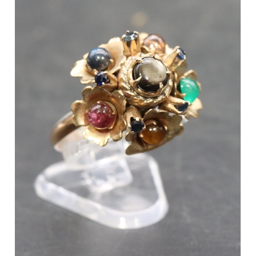 533 - A gold ladies' cluster ring set with 7 different coloured stones interspersed by small sapphires, Si... 