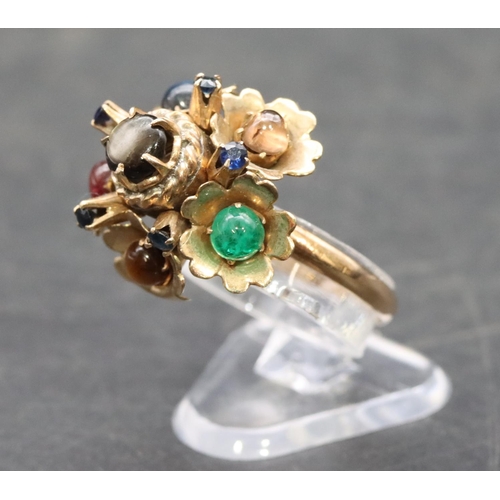 533 - A gold ladies' cluster ring set with 7 different coloured stones interspersed by small sapphires, Si... 