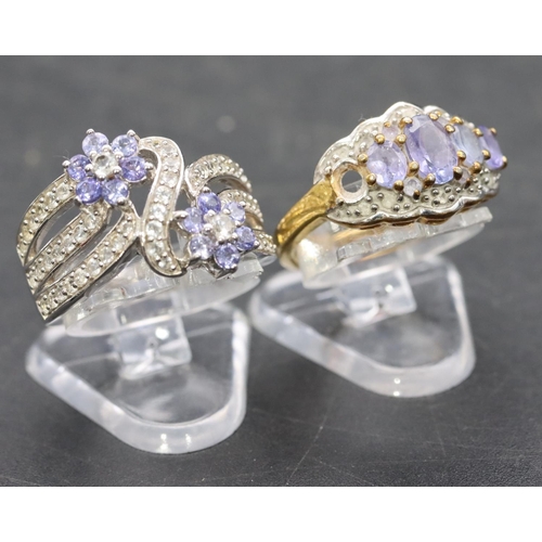 539 - A 925 ladies' floral ring set with small diamond chips, Size L/M and a similar ladies' ring (1 stone... 