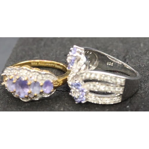 539 - A 925 ladies' floral ring set with small diamond chips, Size L/M and a similar ladies' ring (1 stone... 