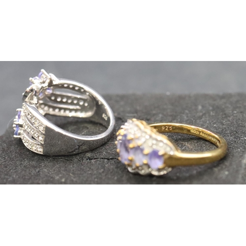 539 - A 925 ladies' floral ring set with small diamond chips, Size L/M and a similar ladies' ring (1 stone... 