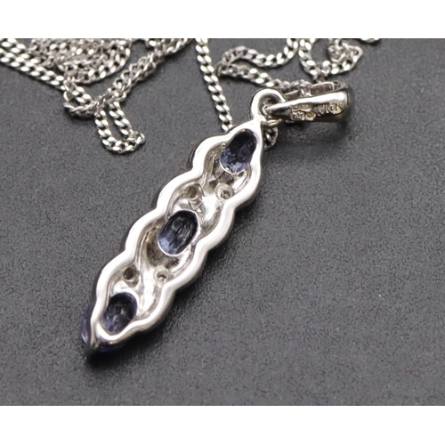 542 - A 9ct white gold small drop pendant set with pale blue stones and small diamond chips with chain, 2.... 