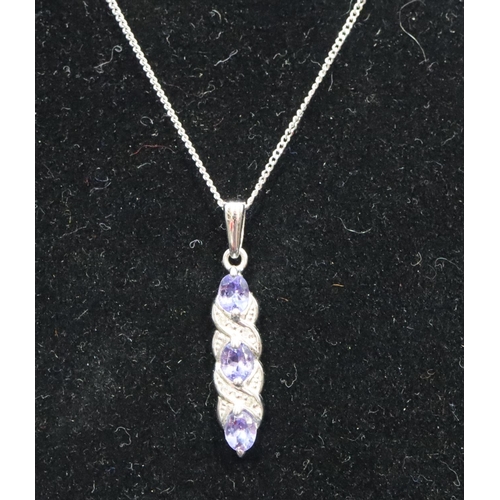 542 - A 9ct white gold small drop pendant set with pale blue stones and small diamond chips with chain, 2.... 