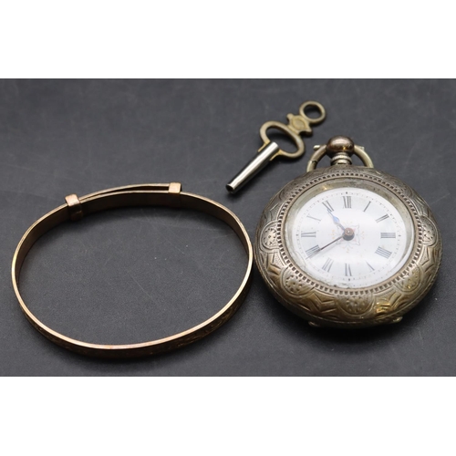 548 - A Continental silver coloured metal round fob watch with white enamel dial and Roman numerals, allov... 