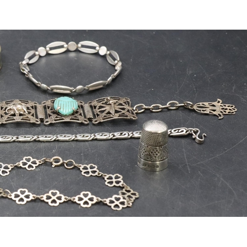 557 - An Eastern silver panelled bracelet, a silver brooch and a small quantity of various silver and othe... 