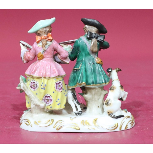 56 - A Continental china group of gentleman and a lady holding guns with dogs at their feet, 10cm high