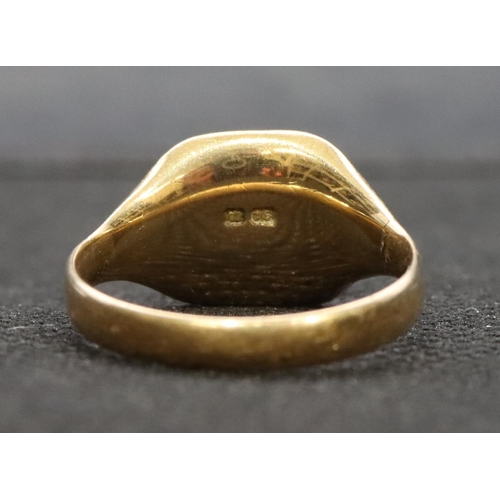 563 - An 18ct gold signet ring, Size R, 8.2 grams