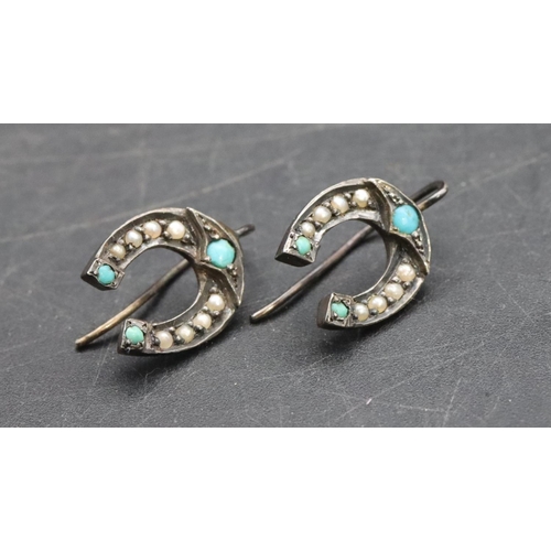 576 - A pair of 19th Century silver earrings in the form of horseshoes inset with turquoise and half pearl... 