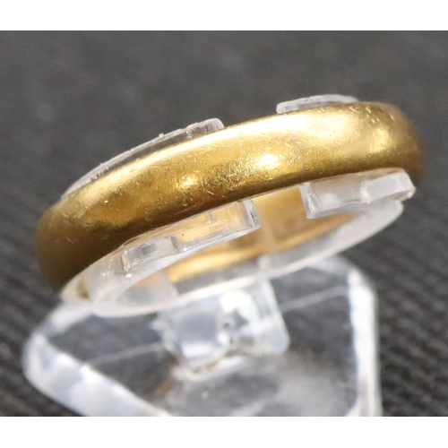 590 - A 22ct gold wedding ring, Size M/N, 7.3 grams