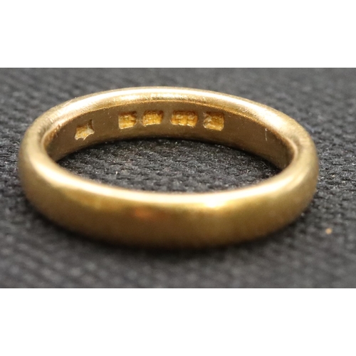 590 - A 22ct gold wedding ring, Size M/N, 7.3 grams