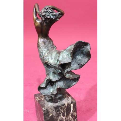 614 - After Milo bronze figure of a standing female in nude in the wind, signed, on square black onyx base... 