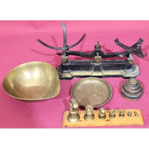 628 - A set of cast iron and brass scales with various graduated weights